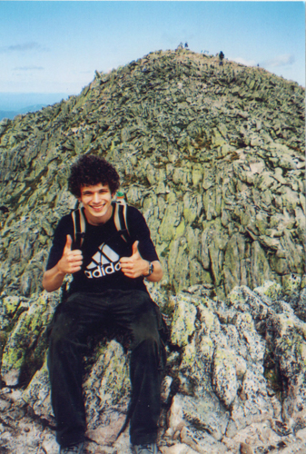 I sit atop Chimney Peak, the wall we just descended behind me.