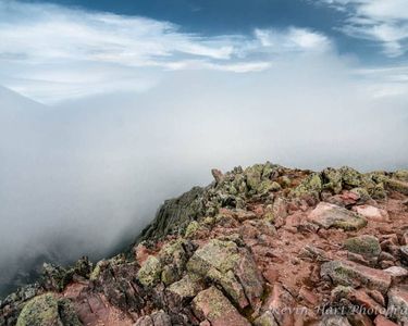 "Where Rock and Sky Meet III - Contact" - Cloud and mountain meet. Pamola Peak.
